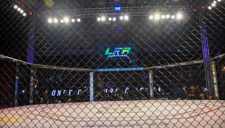LFA Octagon cage in foreground, LFA Brasil logo in background at an event in Brazil