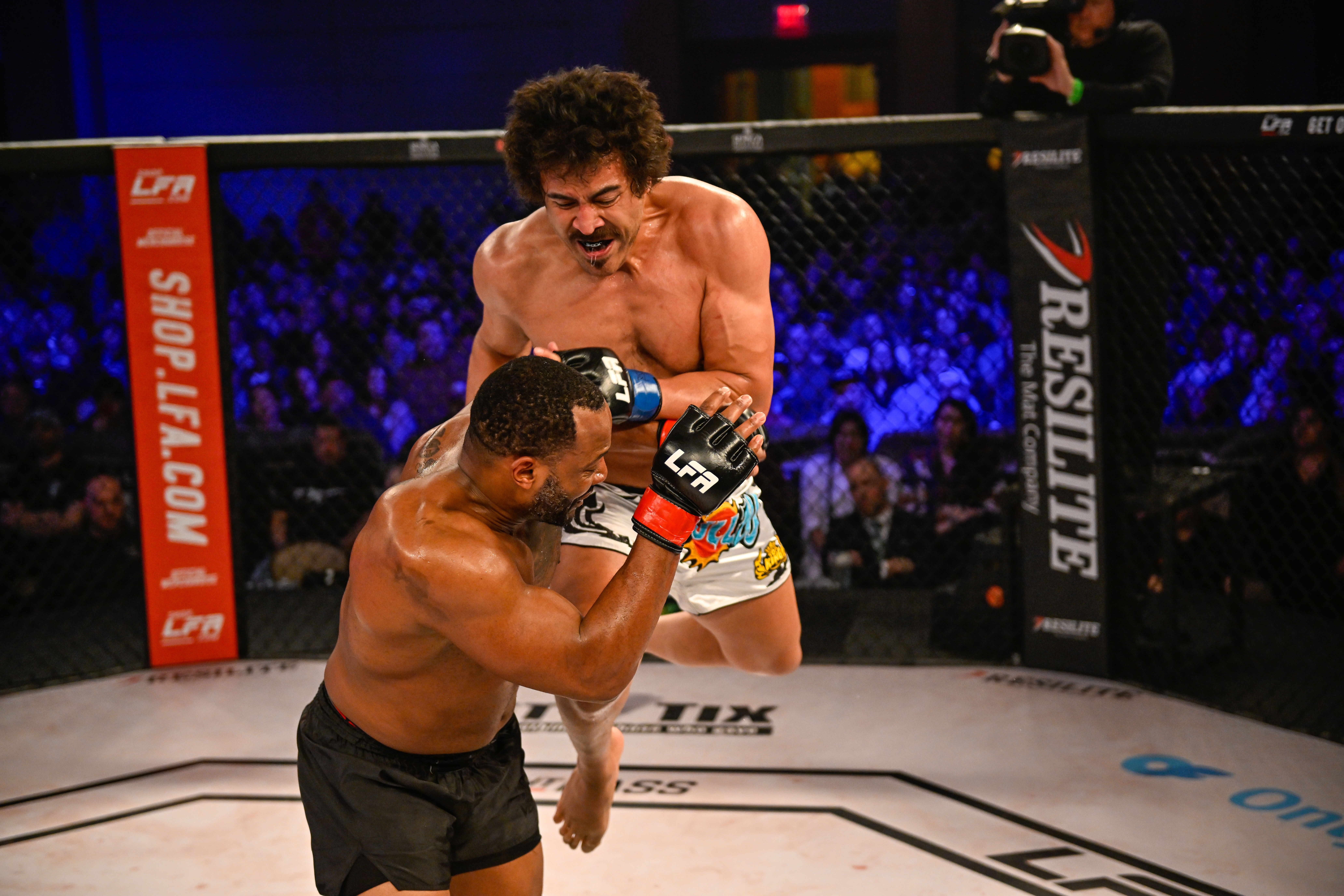 Phil Latu lands a flying knee against Joe Taylor in his LFA debut